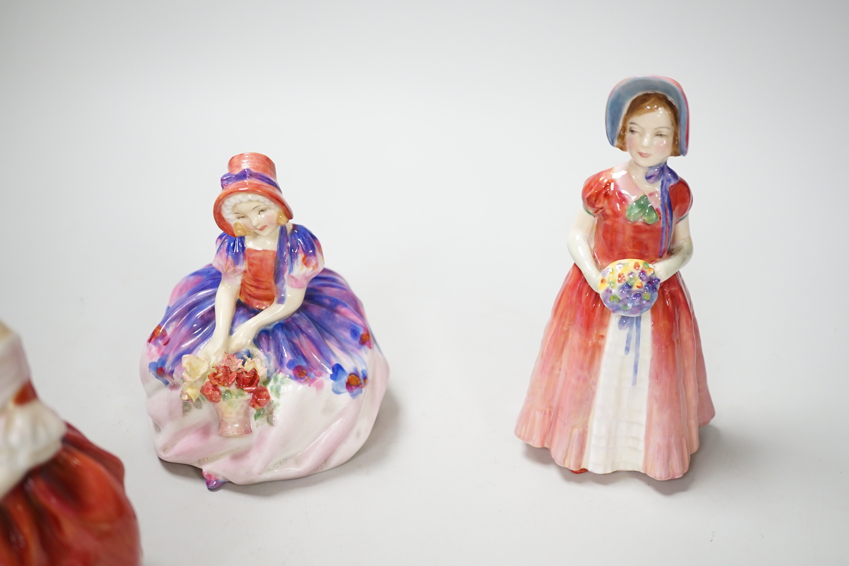 Four Royal Doulton figurines, including Monica HN 1458 and Monica NN 1467